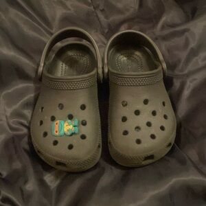 New black unisex toddler crocs. Size 9.